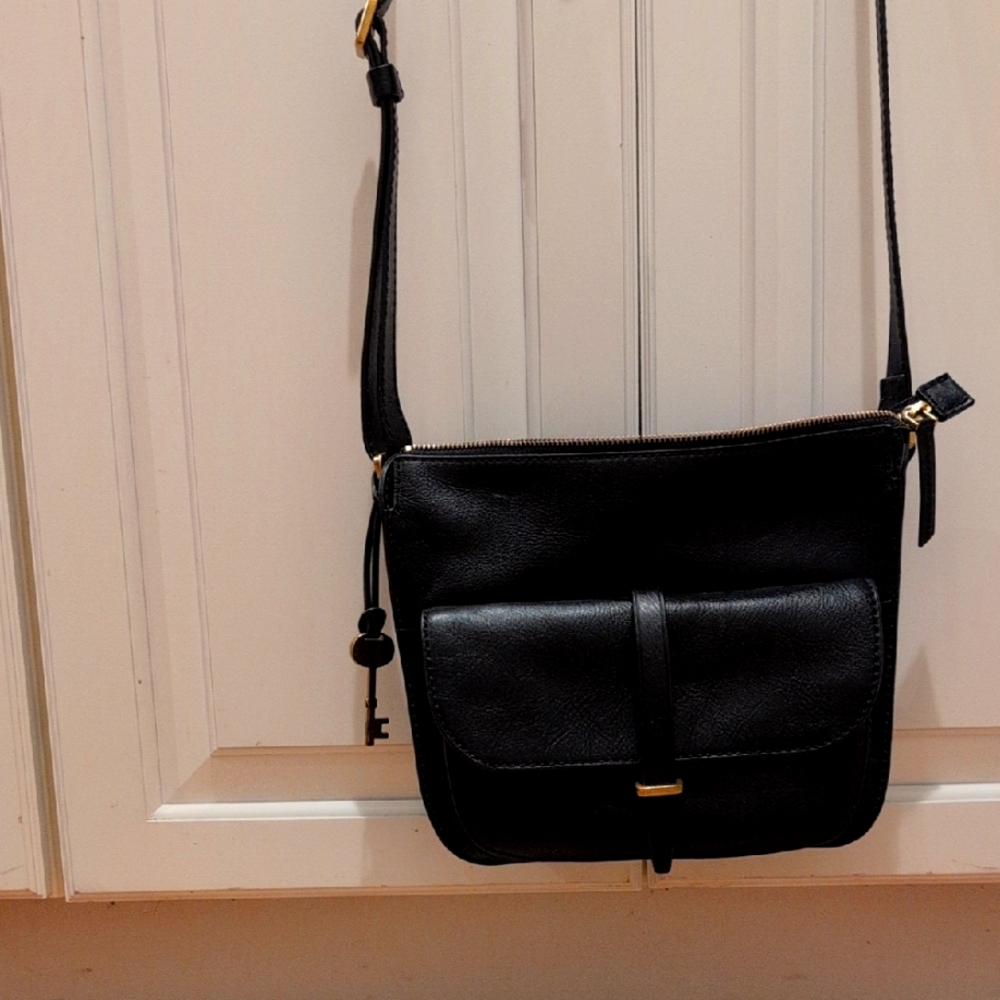 Black Crossbody Bag with Structured Design and Flap Closure